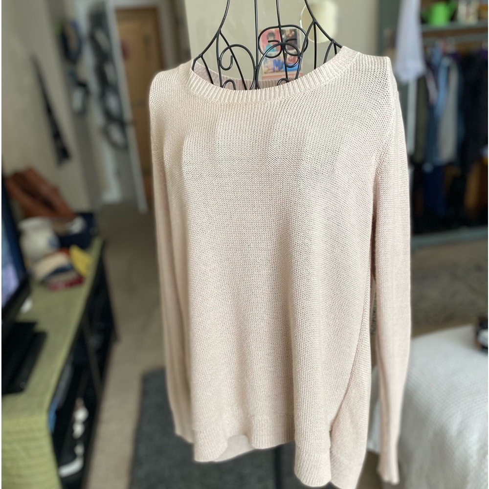 tan colored sweater with open back